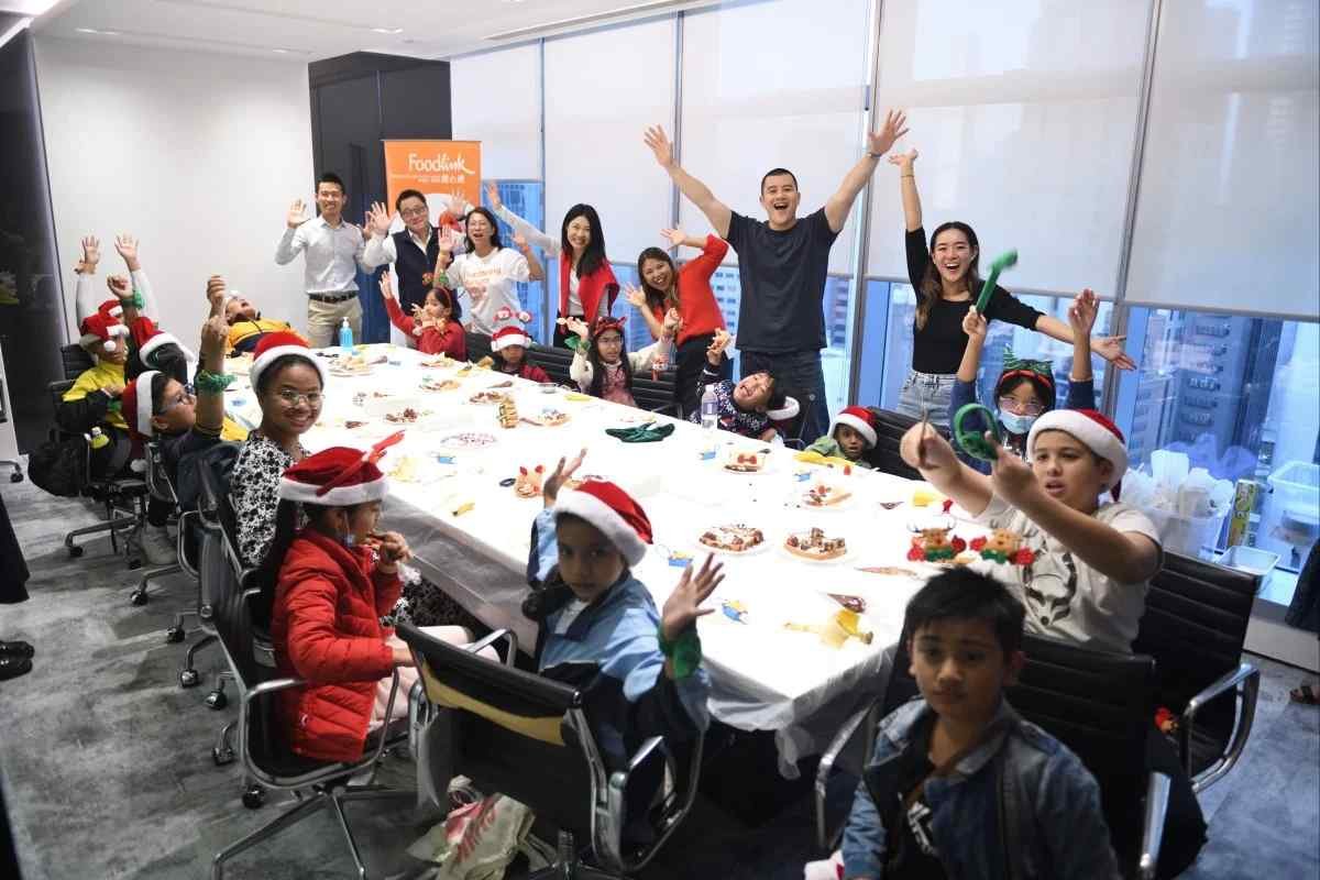 Hong Kong hedge fund puts its money into bringing Christmas cheer to youngsters alongside an Operation Santa Claus beneficiary