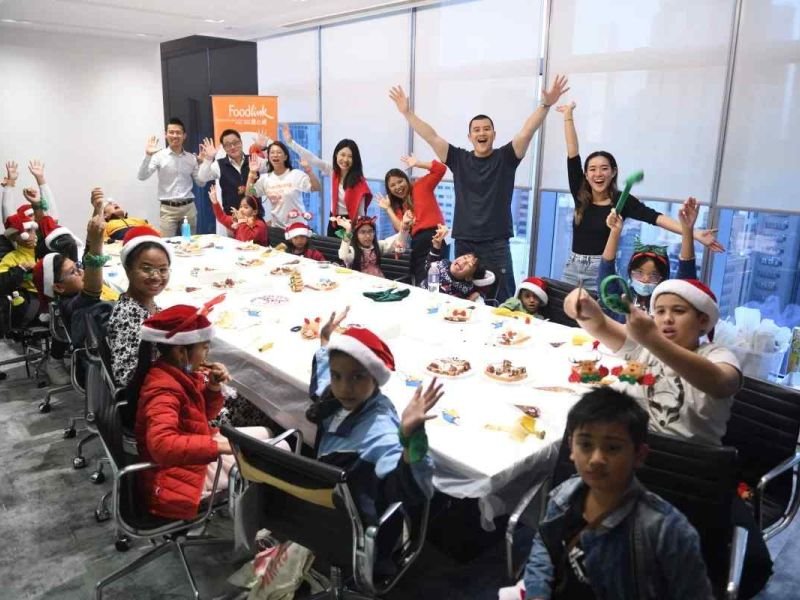 Hong Kong hedge fund puts its money into bringing Christmas cheer to youngsters alongside an Operation Santa Claus beneficiary